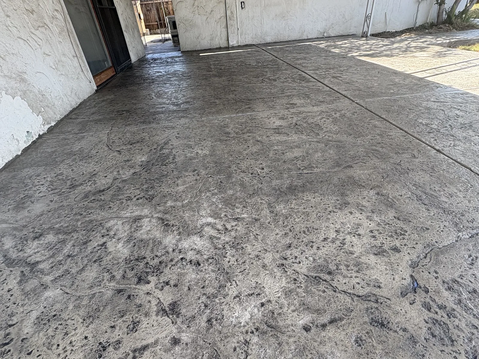 Stamped concrete floor under a covered back patio at a Modesto-area home